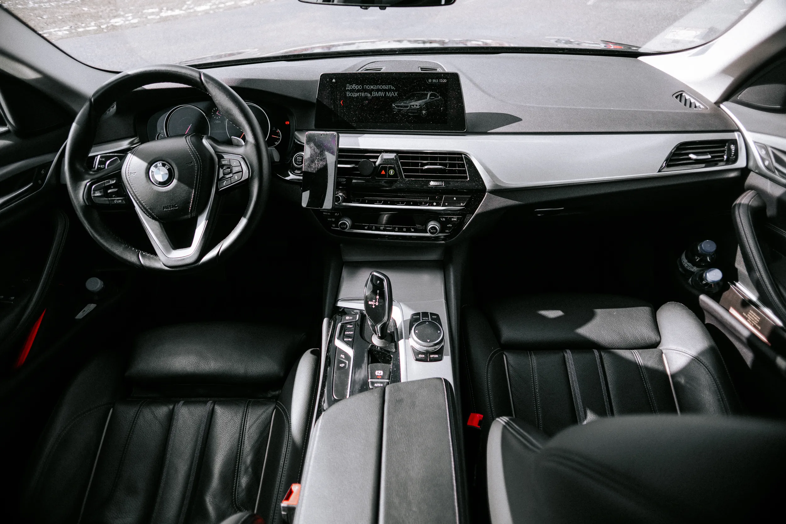 Front passenger interior of BMW 5 Series business class vehicle