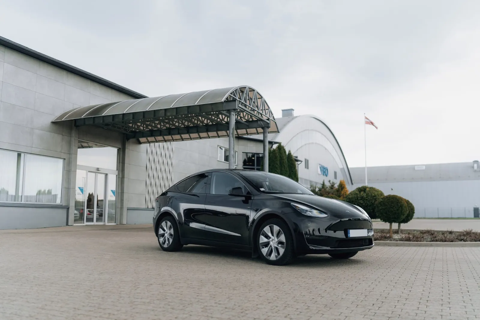 esla Model Y electric vehicle front view for modern chauffeur transfers