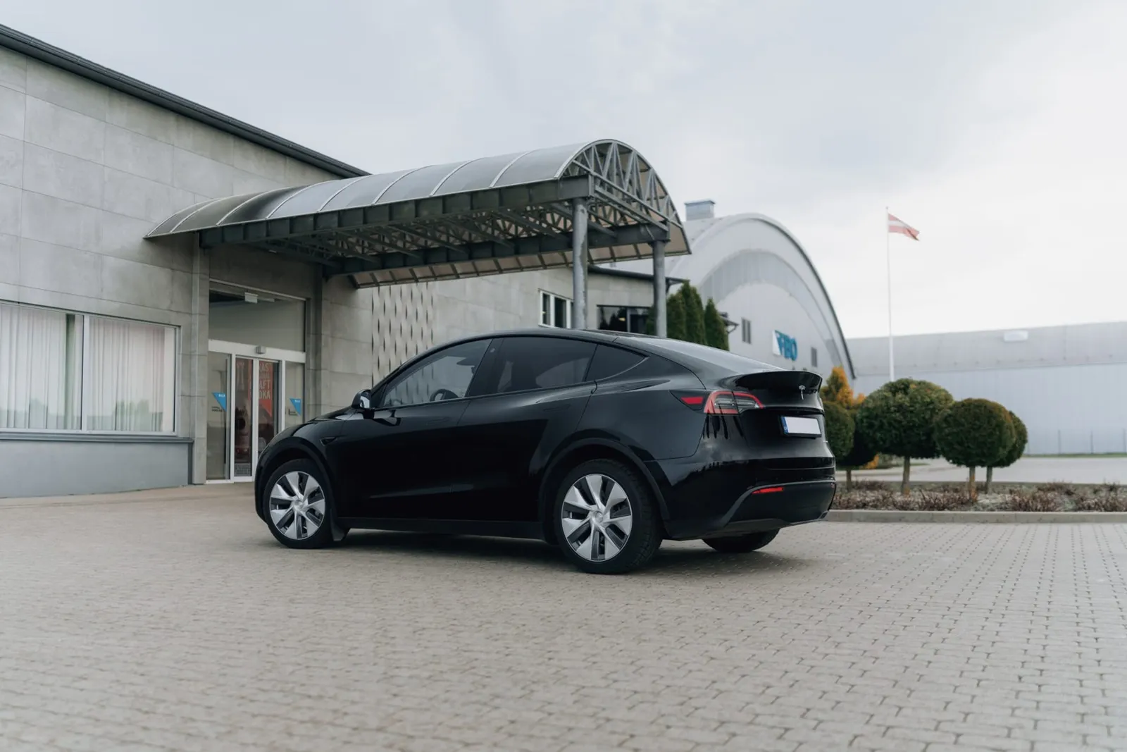Tesla Model Y electric vehicle rear view suitable for airport and city transfers